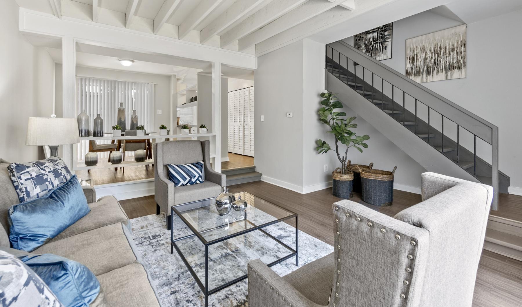 a living room with a staircase