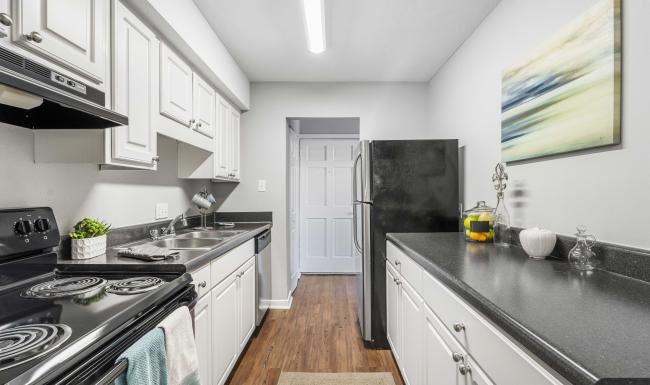 a kitchen with white cabinets
