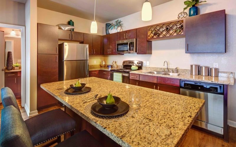 a kitchen with a marble island