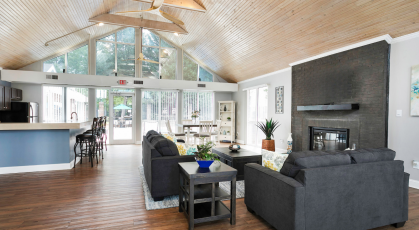 Resident clubhouse with wood floors and lounge seating