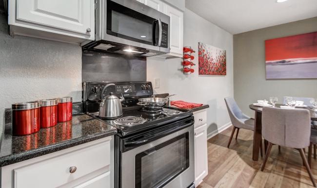 a kitchen with a stove and oven