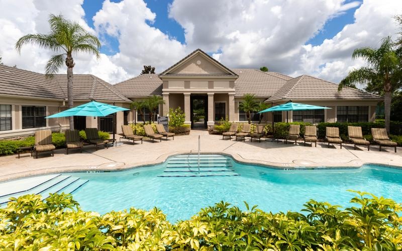 a swimming pool in front of a building