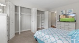 Bedroom with lots of natural light and large closets
