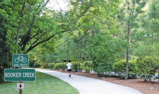 a person running on a path in a park