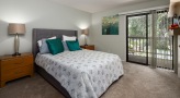 Bedroom with lots of natural light and balcony access