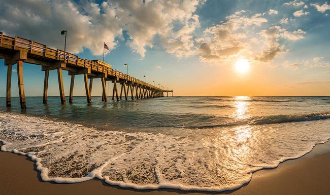 a long wooden pier over the water