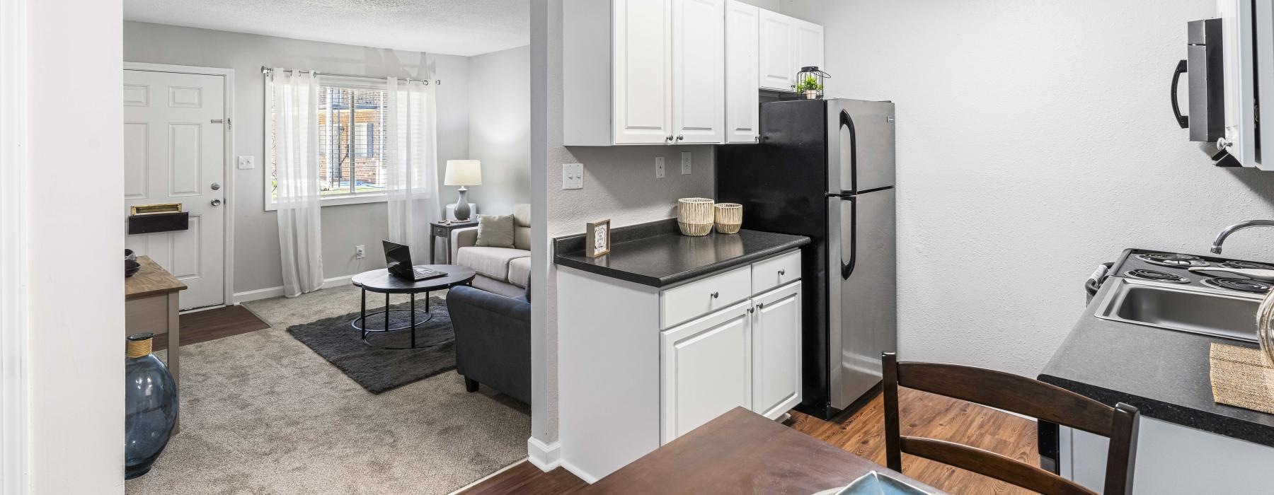 a kitchen with white cabinets