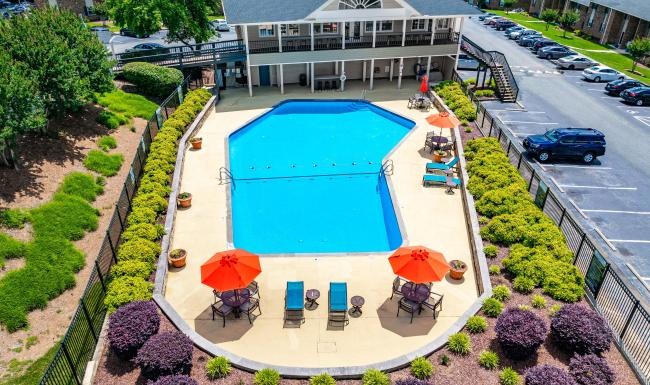 a pool with a building in the background