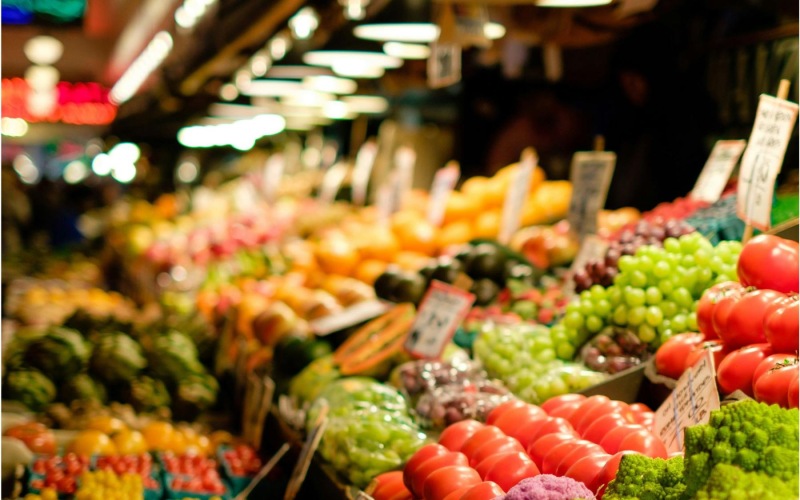 a market with vegetables and fruits