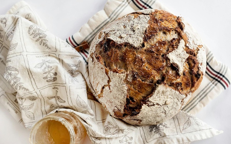 a fresh loaf of bread on a towel