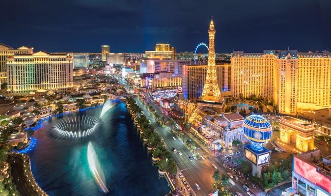 a city with a river and a tower in the middle