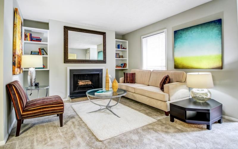 a living room with a fireplace and a couch