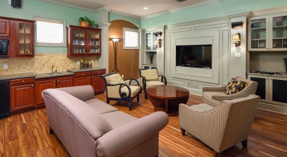 Media room with seating along with sink and counter area