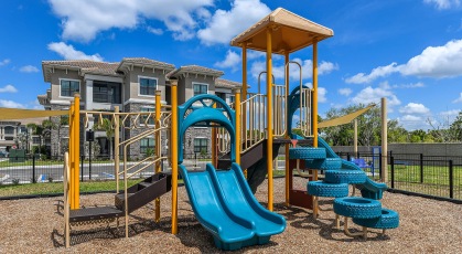 Outdoor playground with slides and climbing equipment