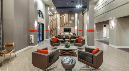 Spacious clubhouse with high ceilings and recessed lighting 