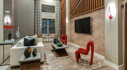  Clubhouse with wall mounted tv and viewing couch 