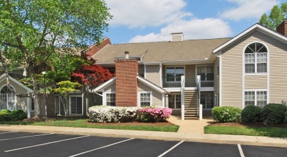 Two-story apartment buildings situated on beautifully landscaped grounds