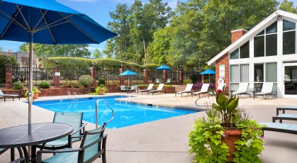 Sparkling pool and lounge chairs