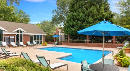 Sparkling pool and lounge chairs