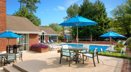 Sparkling pool and lounge chairs