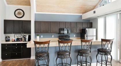 Resident clubhouse kitchen with barstools