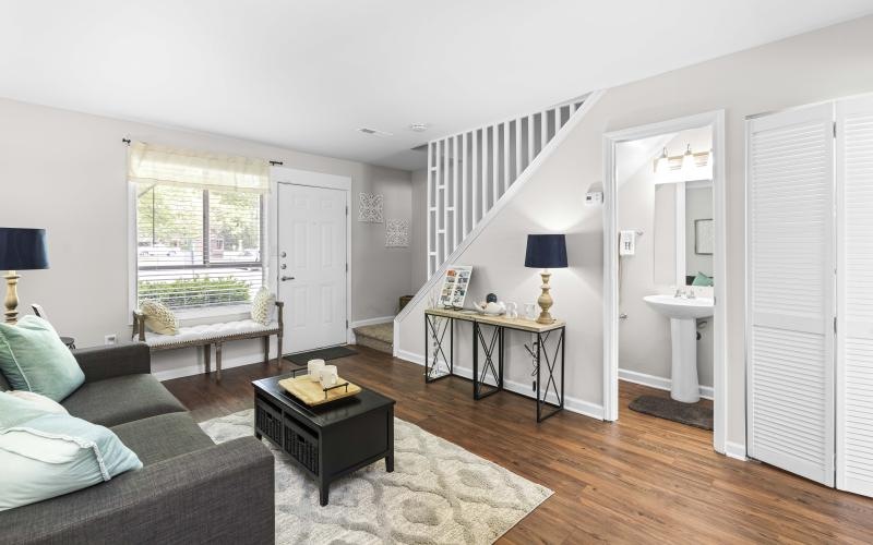 a living room with a couch and tables