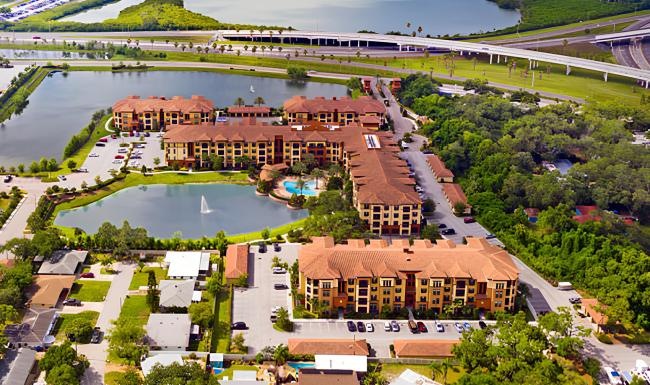 a large building complex next to bodies of water