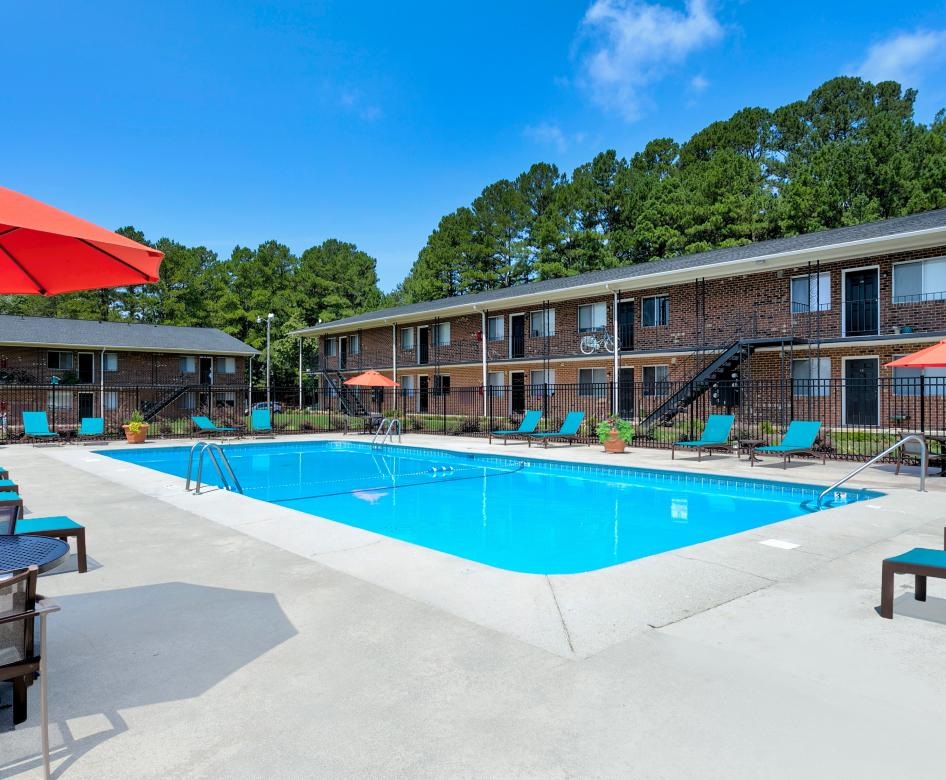 a swimming pool in front of a building