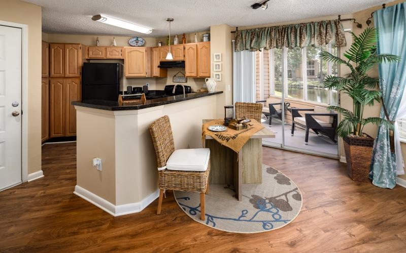 a living room with a table and chairs
