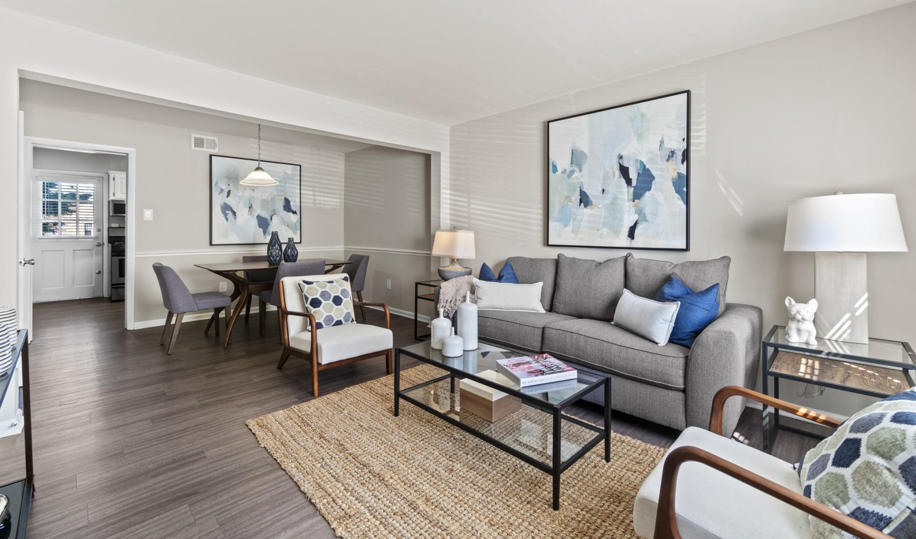 a living room with a couch and chairs