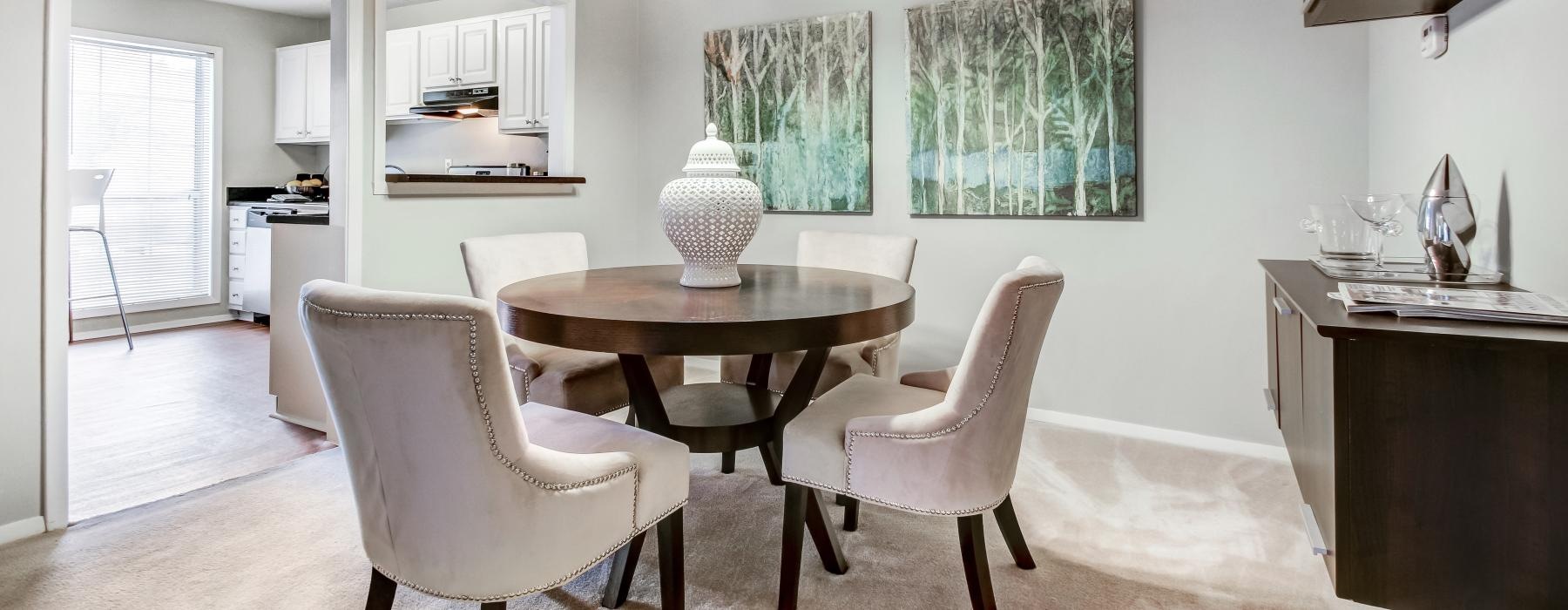 a dining room with a table and chairs