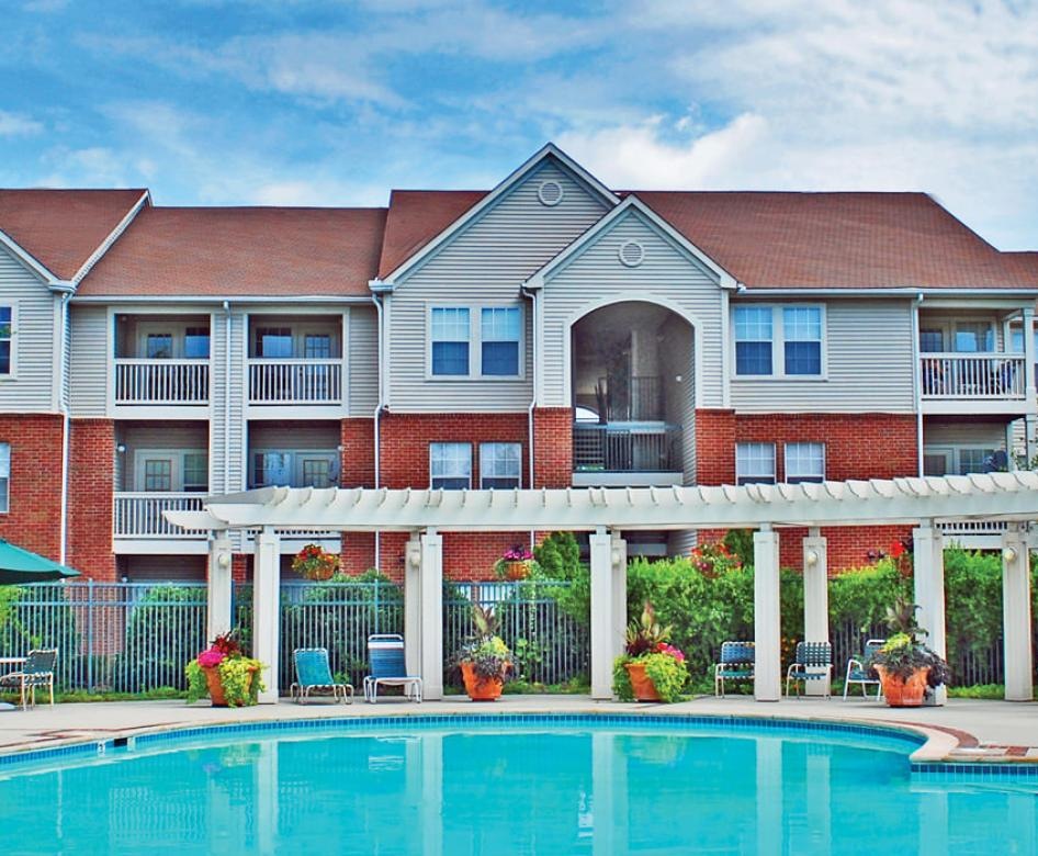 a pool in front of a building