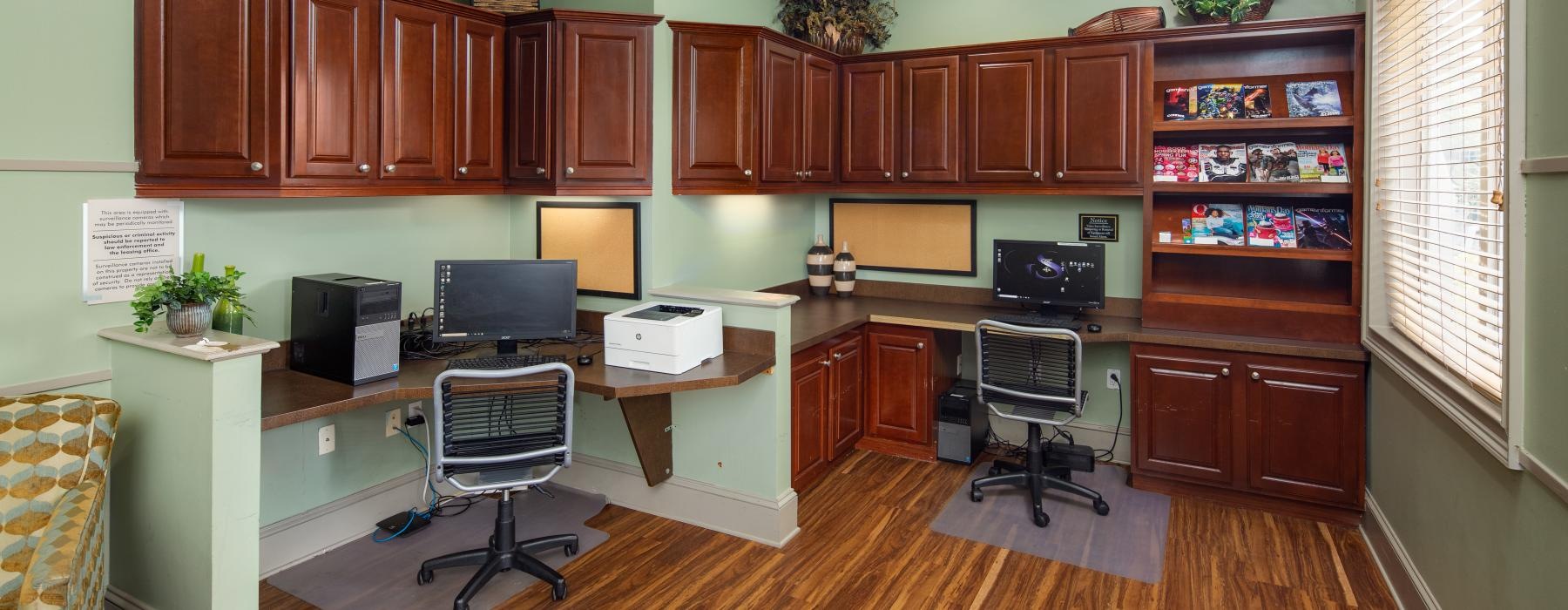 business center with computers and printer