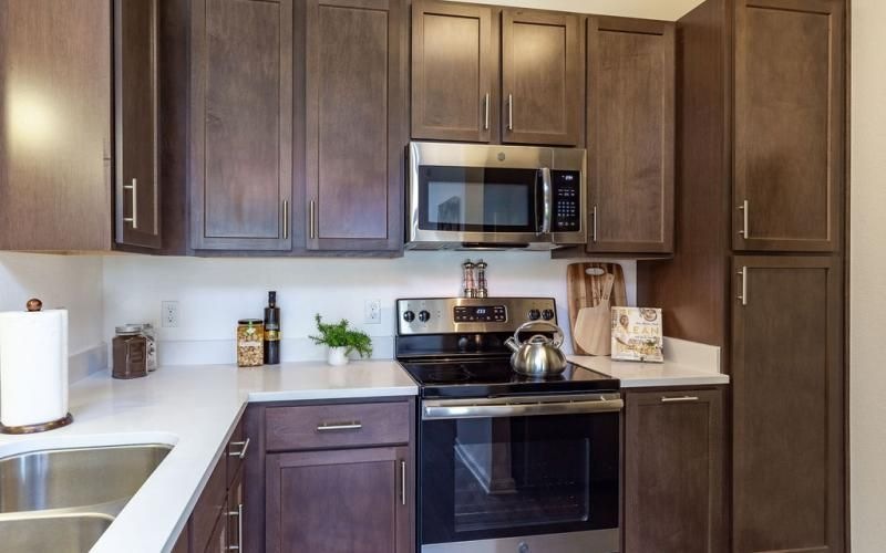 a kitchen with wooden cabinets