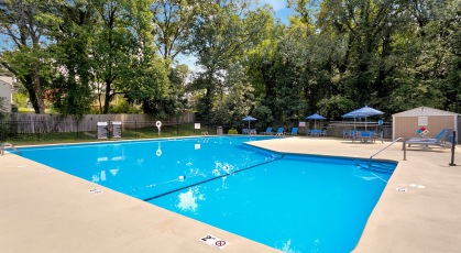 Sparkling swimming pool with lounge seating area