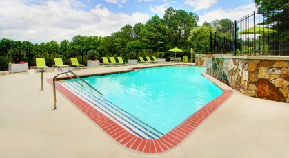 Pool surrounded by adjustable lounge seating