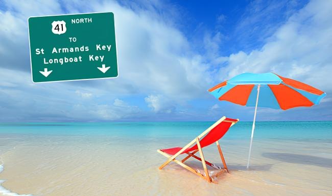 a chair and umbrella on a beach