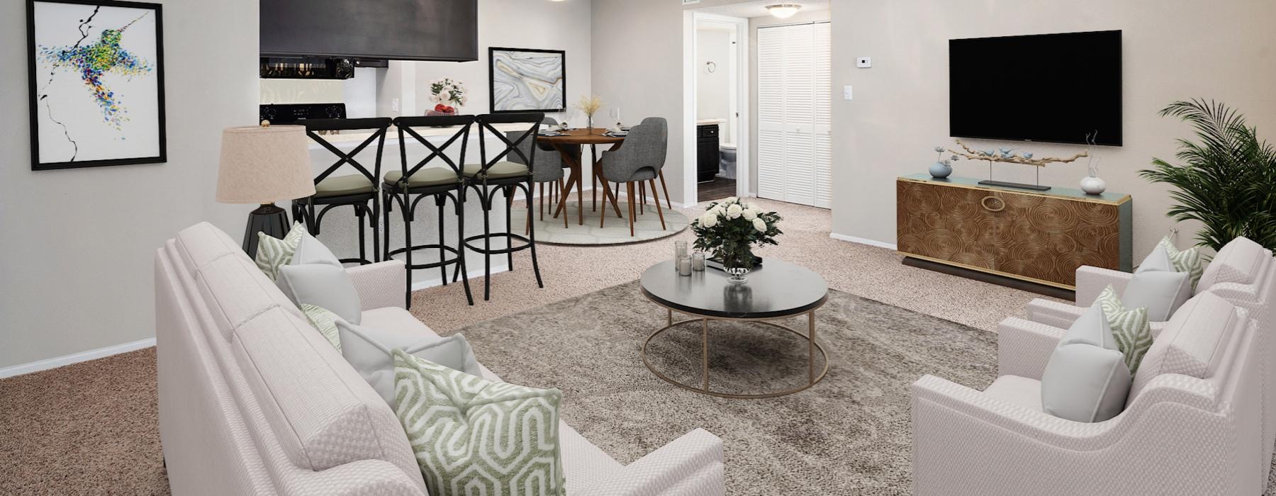 a living room with a table and couches and tv