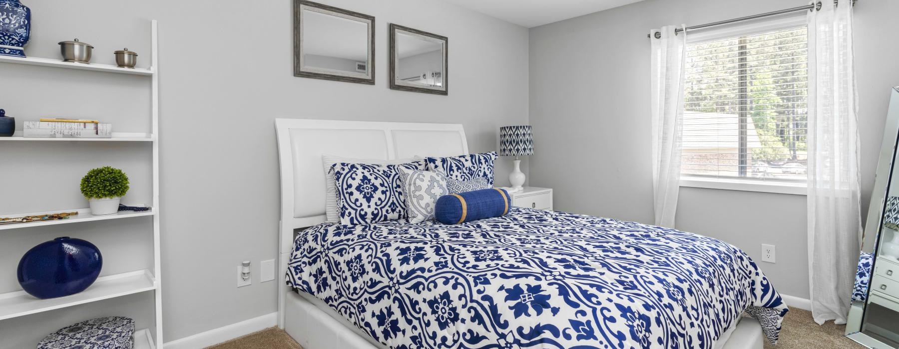 a bedroom with a bed and shelves