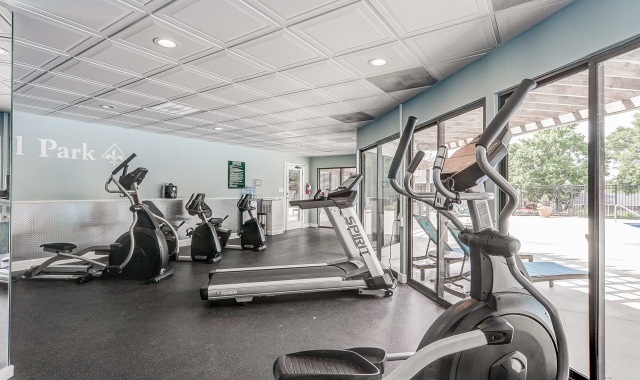 Fitness center, two sparkling pools, and outdoor grilling area