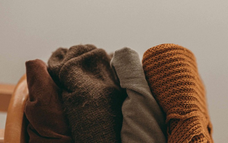 various fabrics and blankets lined up together