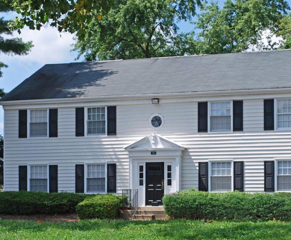 a white house with black shutters