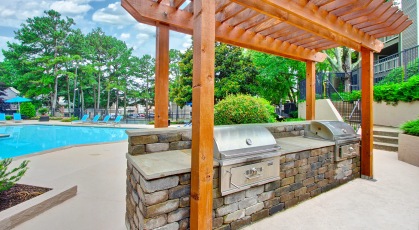 Covered grill area near pool