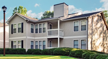 Apartment balcony and patio with views of neatly manicured lawns