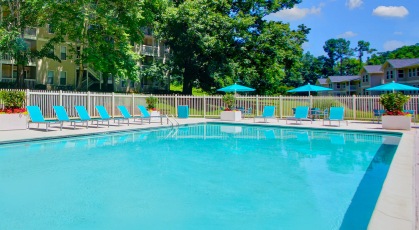 Large pool surrounded by adjustable lounge chairs
