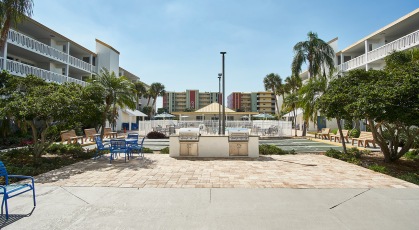 Grilling area with picnic tables and chairs