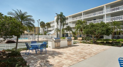 Outdoor grilling station next to pool