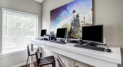 Computer workstations in open concept clubhouse