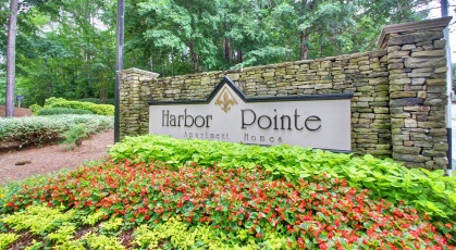 Harbor Pointe stone sign surrounded with manicured landscaping