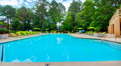 Swimming pool with lounge chairs and umbrellas